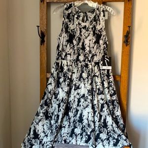 Women’s black and white swing dress, new with tags. Size petite large